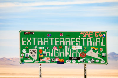 Signboard against the sky