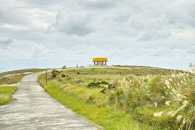 View of landscape against cloudy sky