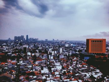 High angle view of modern buildings in city against sky