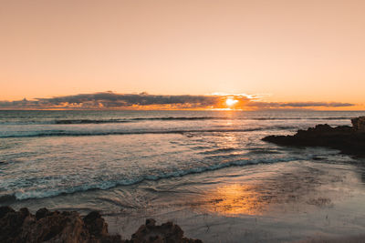 Scenic view of sea against sky during sunset