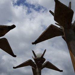 Traditional windmill against sky in city