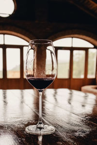 Close-up of wineglass on table