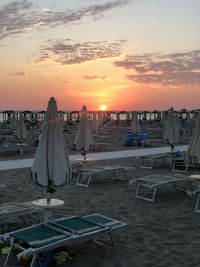 Scenic view of beach against sky during sunset