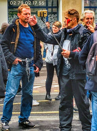 Group of people walking on city street