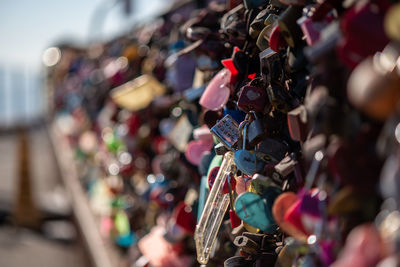 Close-up of padlocks hanging on railing