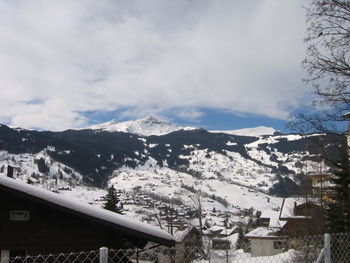 Residential district against cloudy sky