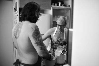 Men preparing food at home