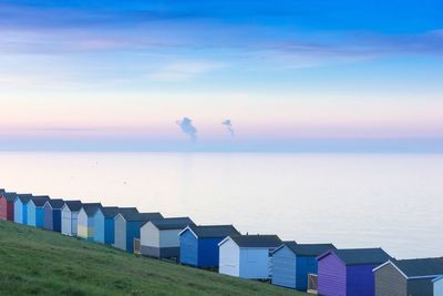 Panoramic view of beach against sky during sunset