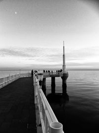 Pier over sea against sky