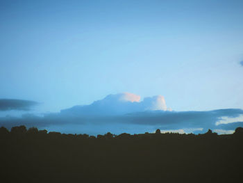 Silhouette landscape against scenic sky