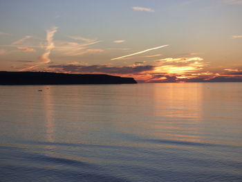 Idyllic view of sea against sky during sunset