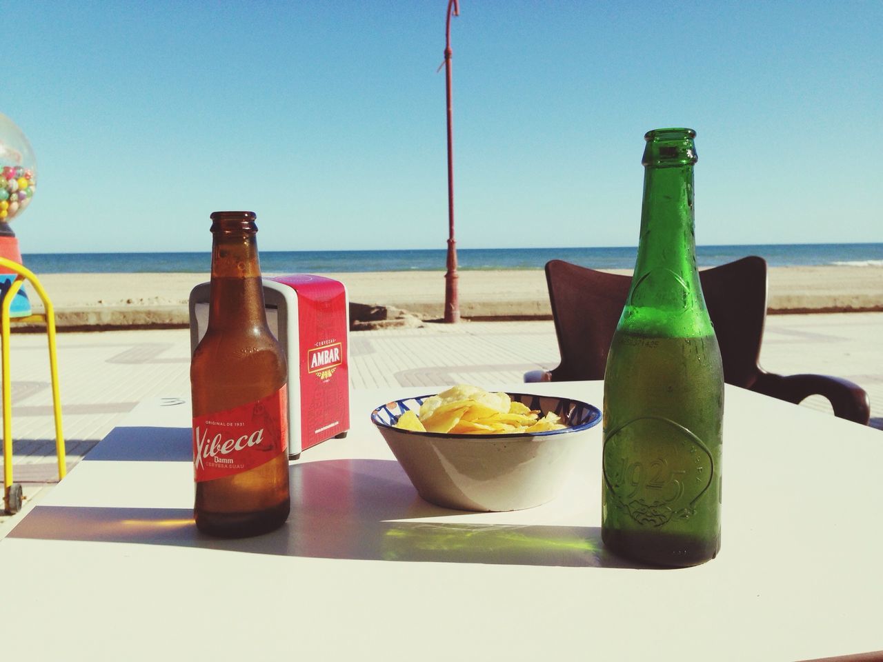 food and drink, horizon over water, sea, drink, table, freshness, food, water, beach, refreshment, healthy eating, still life, drinking glass, clear sky, drinking straw, plate, ready-to-eat, juice, shore, cocktail