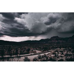 Scenic view of landscape against cloudy sky