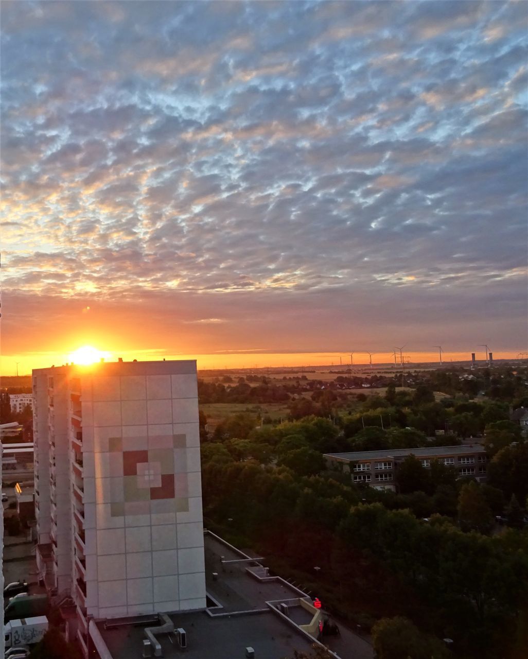 BUILDINGS AGAINST SKY DURING SUNSET