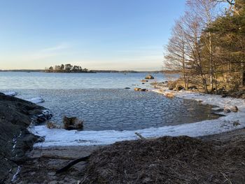 Scenic view of sea against sky during winter