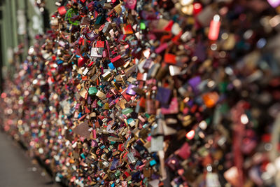 Close-up of love padlocks on railing