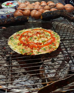 High angle view of meat on barbecue grill