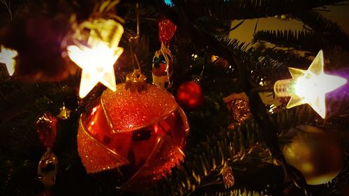 Close-up of illuminated christmas tree at night