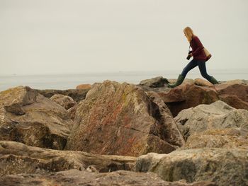 Rear view of man standing on beach