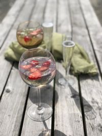 Close-up of gin and prosecco glasses on table