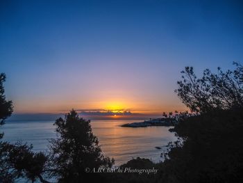 Scenic view of sea against sky during sunset