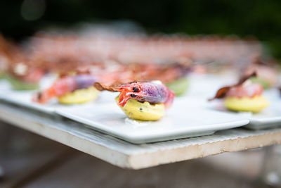 Close-up of finger food in plate on table. gourmet buffet. high angle view of food.