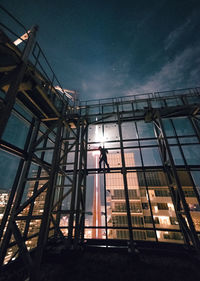 Low angle view of built structure against sky at night