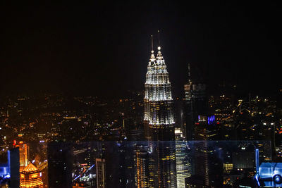 Illuminated buildings in city at night