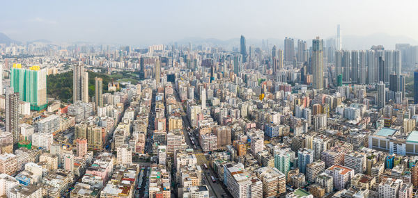 High angle view of modern buildings in city against sky