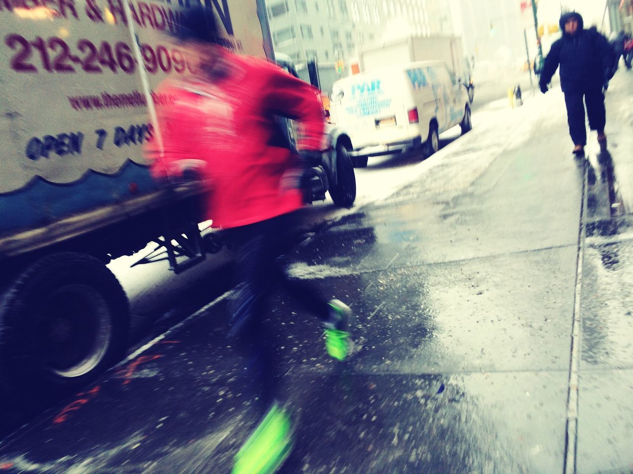 transportation, street, land vehicle, mode of transport, blurred motion, car, on the move, motion, road, city life, men, walking, lifestyles, city street, city, person, text, travel