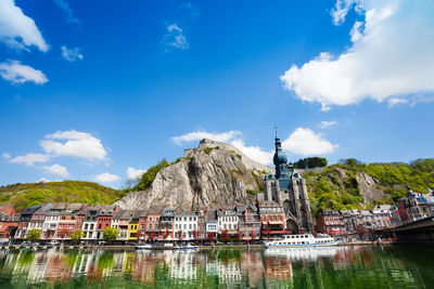 Panoramic view of lake and buildings against sky