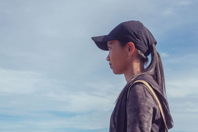 Portrait of senior woman against sky