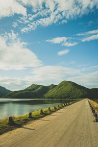 Scenic view of lake against cloudy sky