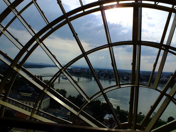 Low angle view of bridge against cloudy sky