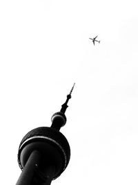 Low angle view of airplane flying in sky