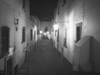 Narrow alley in city at night