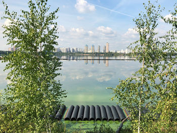 Scenic view of river against cloudy sky