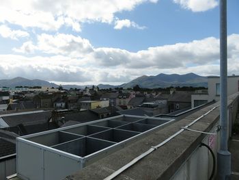 Residential buildings against cloudy sky