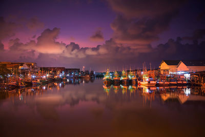 Panoramic view of harbor at night