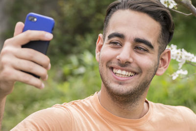 Portrait of young man photographing