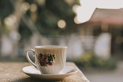 Close-up of coffee served on table at cafe