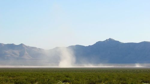 Scenic view of dust devil against clear sky