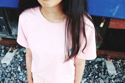 Midsection of woman standing outdoors