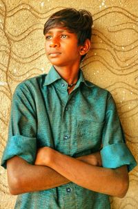 Portrait of teenage boy standing outdoors