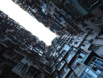 Low angle view of buildings in city against sky