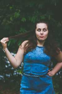 Funny teenage girl making face at park