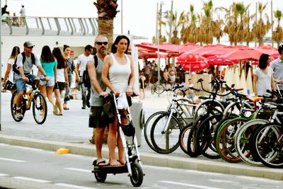 People walking on road in city