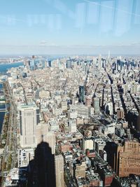 Aerial view of cityscape against sky