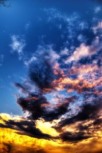 Low angle view of cloudy sky at sunset