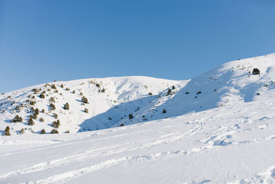 Beautiful landscape of different mountains of beldersay in sunny clear weather with blue sky